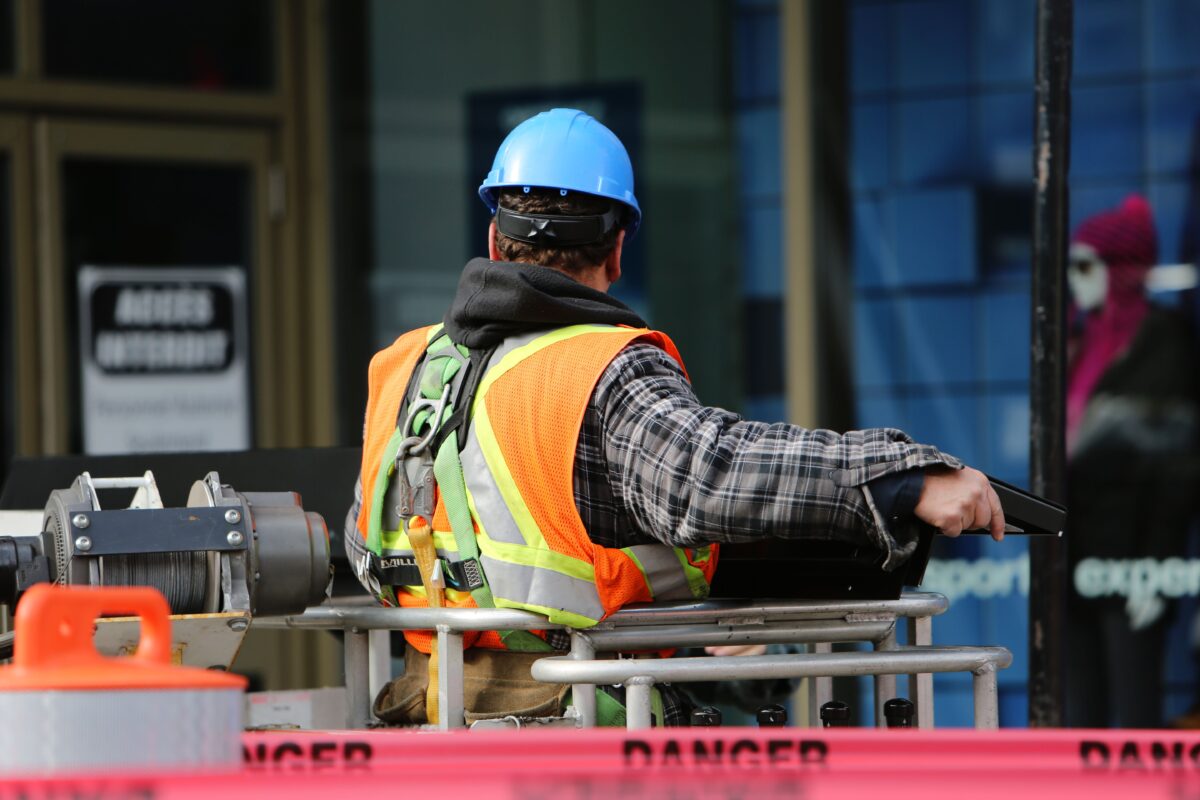 Construction worker on an elevated platform on site